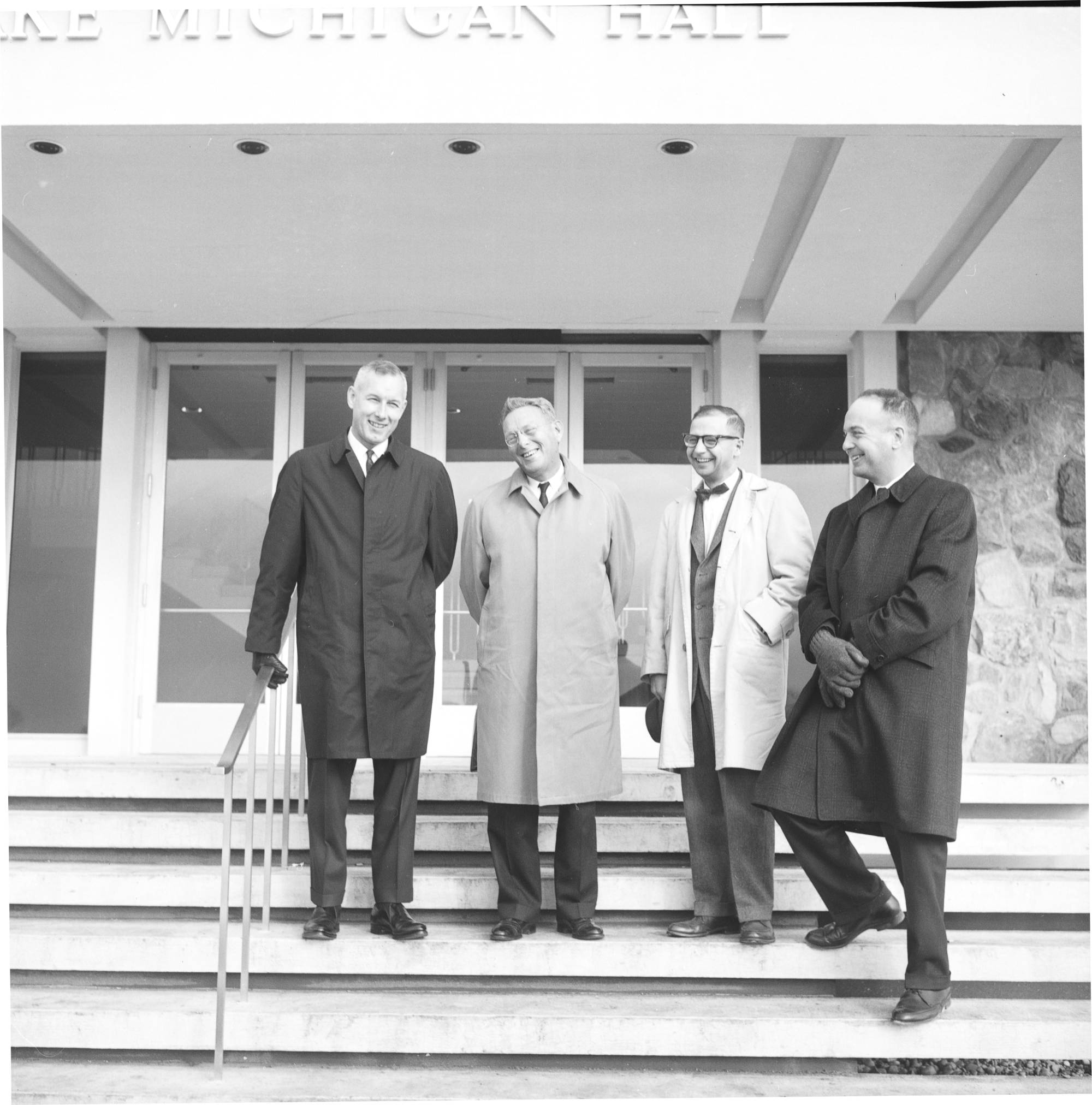 Zumberge, Russell, Jamrich, and Potter on steps of Lake Michigan Hall